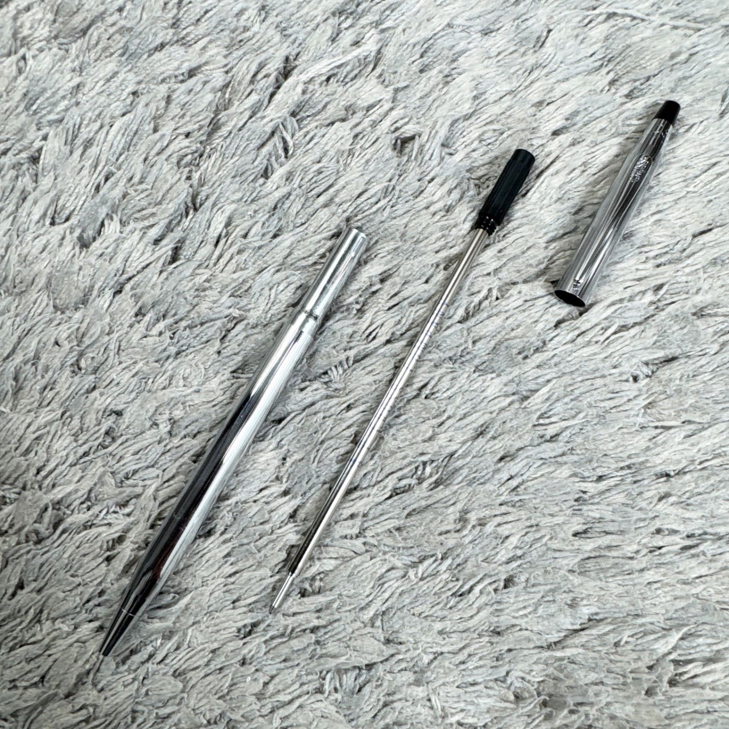 Cross Twist ballpoint pen with blue ink, Japan import, showing small scratches and twist-style design