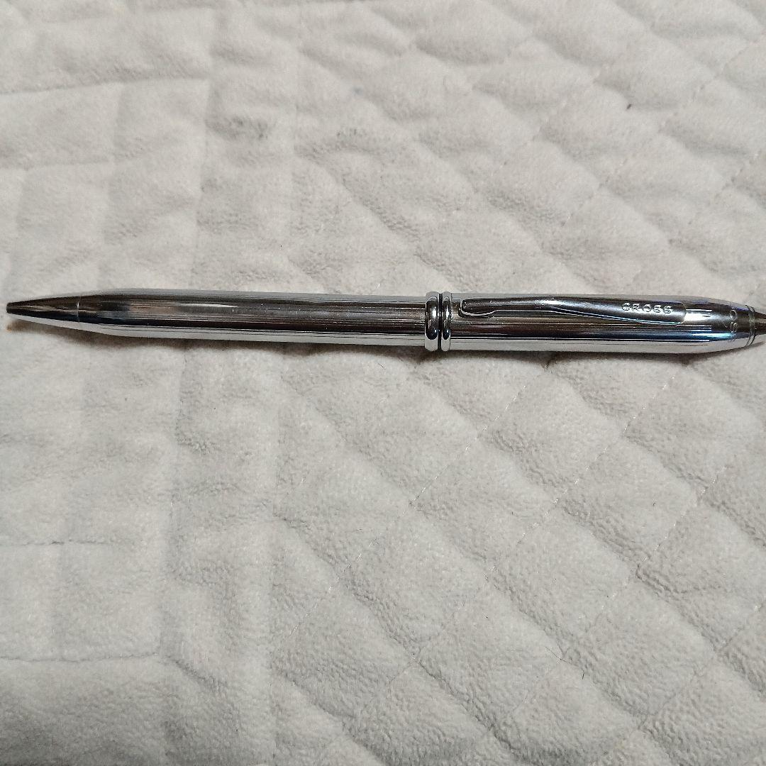 Cross metal ballpoint pen in silver with twist design shown on white background