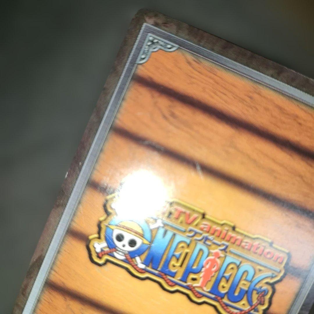 Old One Piece Monkey D. Luffy MS-C10 Pirate's Beacon trading card with signs of aging and damage