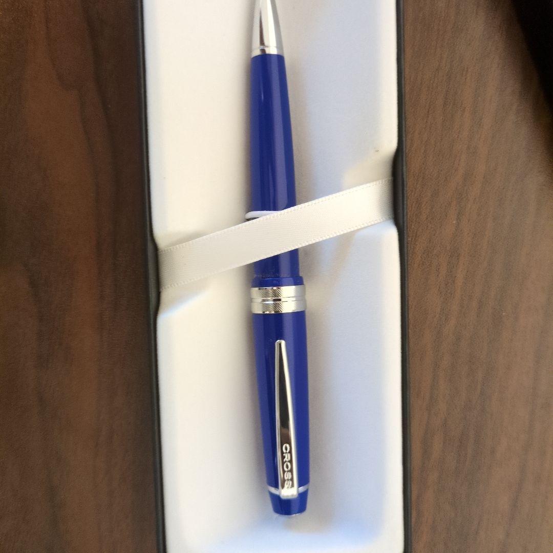 Cross ballpoint pen with vibrant blue body and silver clip featuring a simple, sophisticated design