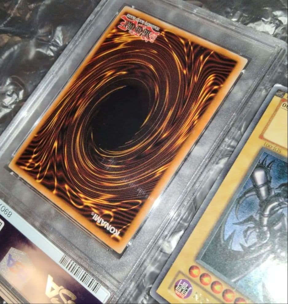 Yu-Gi-Oh! Red-Eyes Black Dragon SDJ-001 Ultra Rare English trading card with yellowed surface