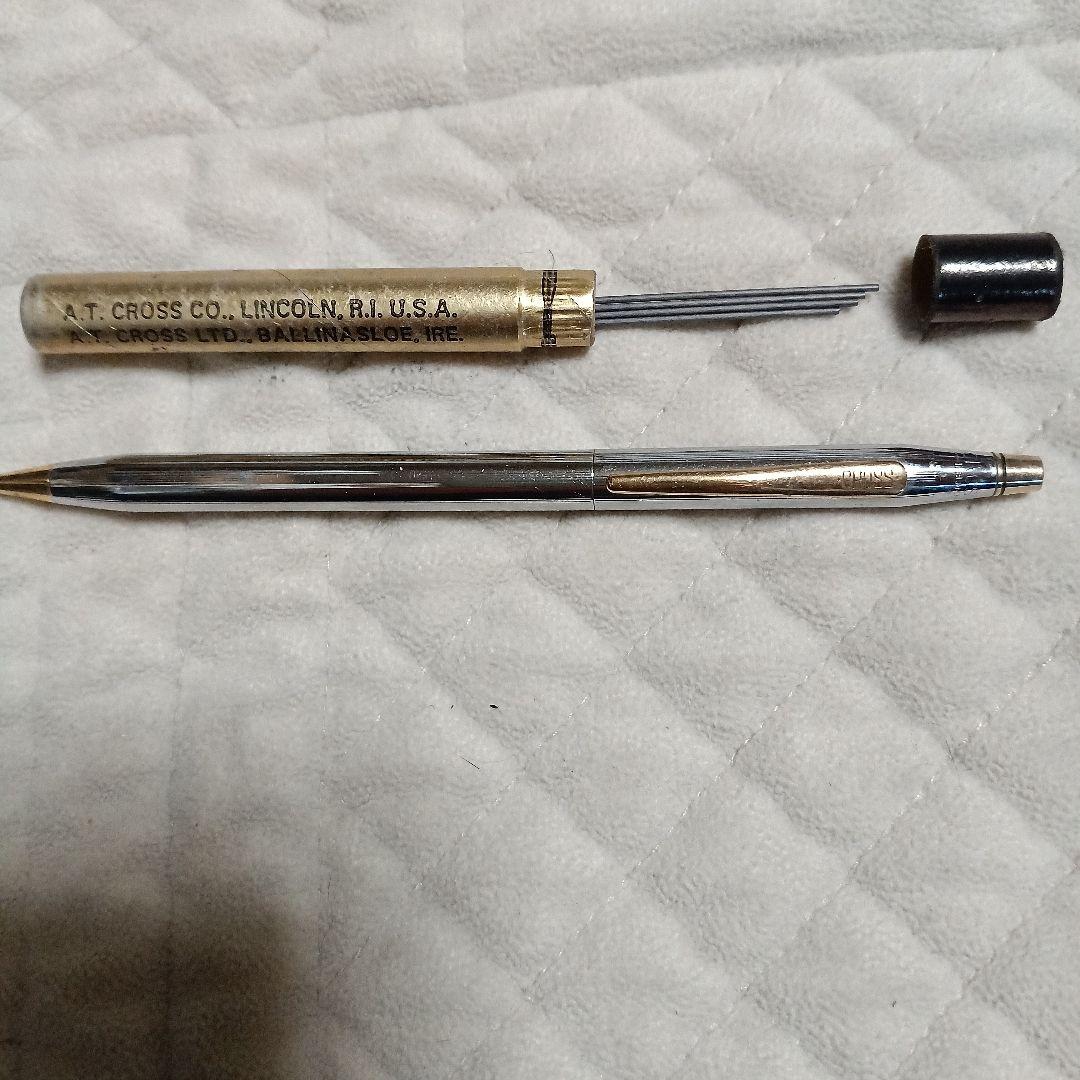A.T. Cross silver and gold ballpoint pen made in USA shown with replacement refill