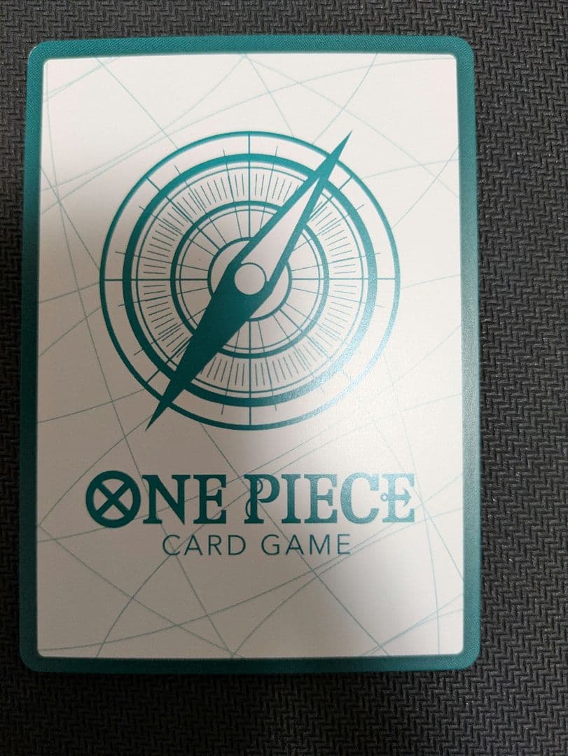 One Piece Card Aokami Shichibukai Don Card Mihawk Gold Don in protective sleeve showing front view