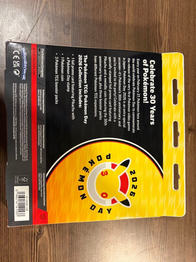 Unopened Pokemon Day 2026 Collection Box Japan Import showing promo card, special coin, and three expansion packs in English