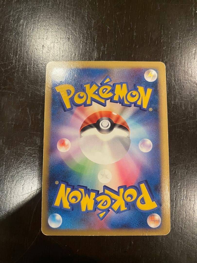 Pokémon Rayquaza C LV.73 1ed card in protective sleeve shown from front