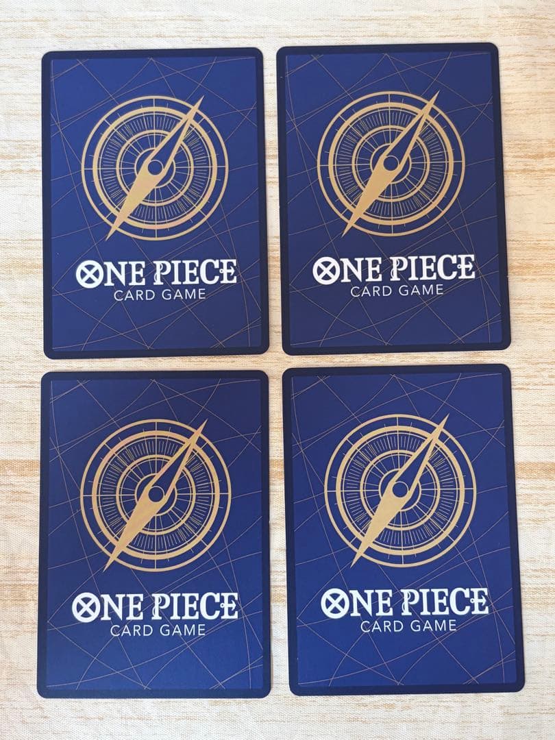 Set of four Japanese playing cards featuring Monkey D. Luffy P-022 and Shanks P-016 characters