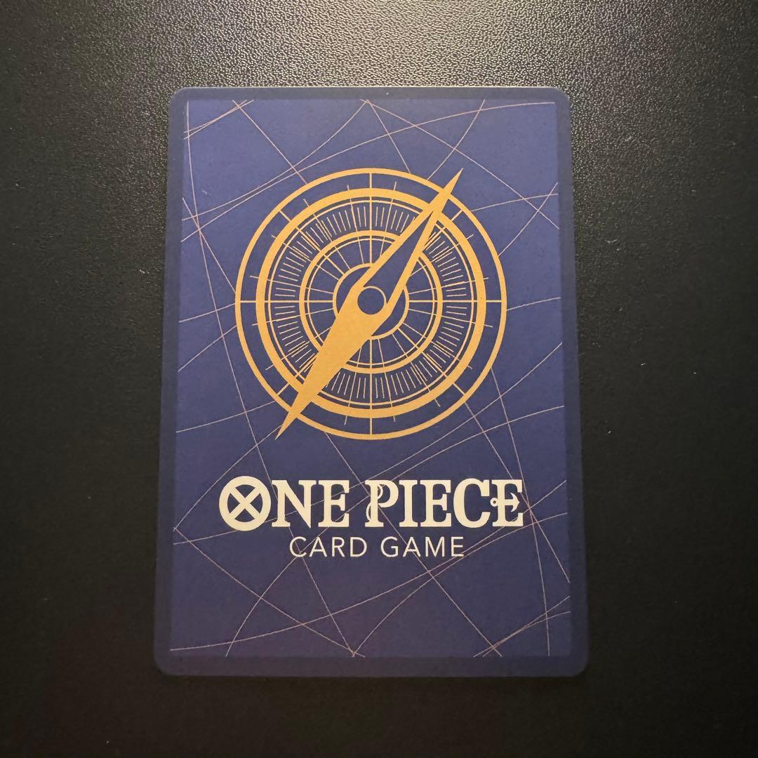 One Piece Nami ST29-008 Parallel Card with a small white chip on the upper back side