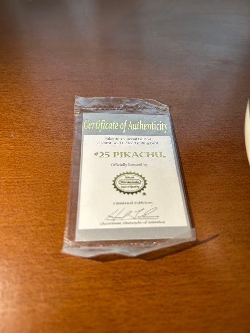 Rare 23K gold-plated Pikachu collectible card from 1999 Burger King US sale with Poké Ball case