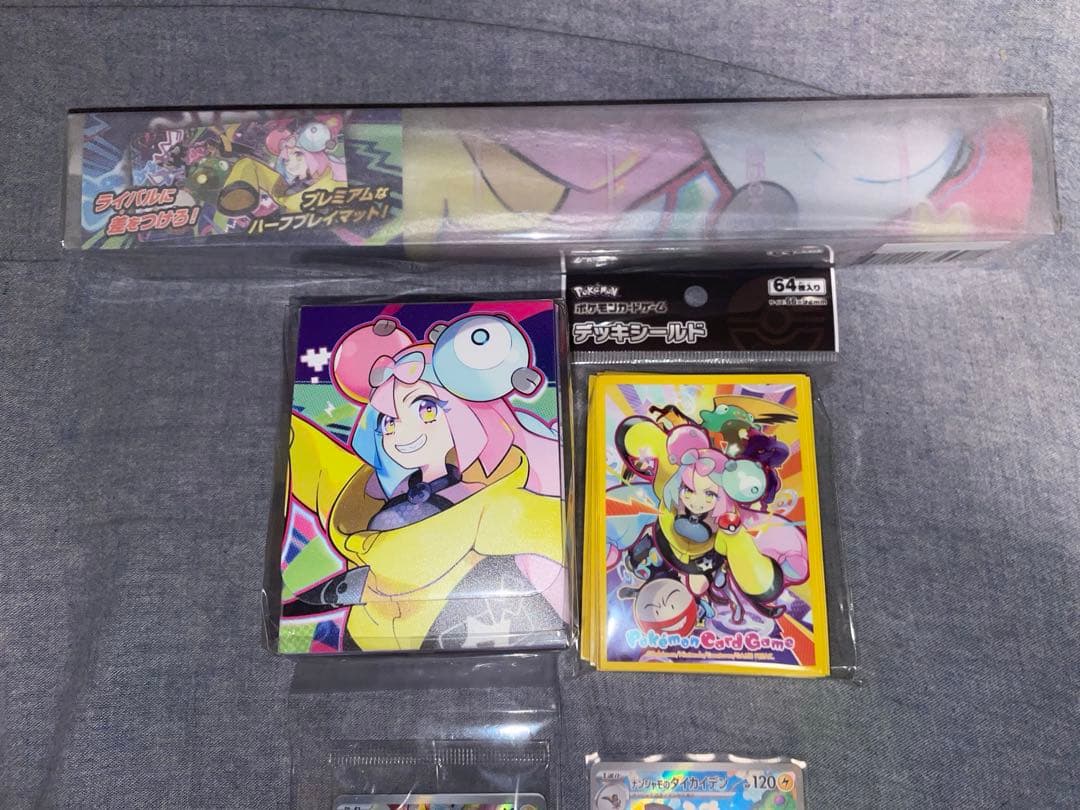 Bandai Nanjamo Battle Partners promo set with playmat, card sleeve, deck case, and unopened Nanjamo's Kaidan promo card