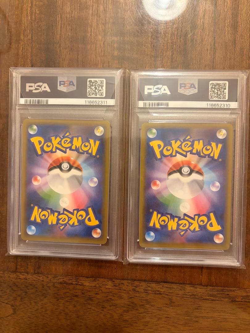 Two Japanese Pokemon 25th Anniversary cards featuring Zekrom and Reshiram graded PSA 10 from 2021