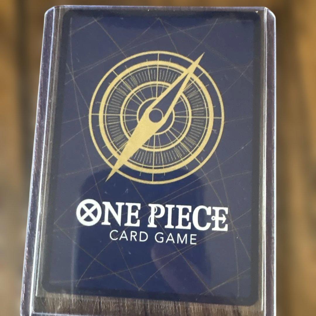 One Piece Card Kamikave OP10-019 event card with powerful KO ability, shown in water-resistant packaging