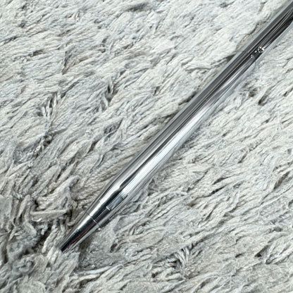 Cross Twist ballpoint pen with blue ink, Japan import, showing small scratches and twist-style design