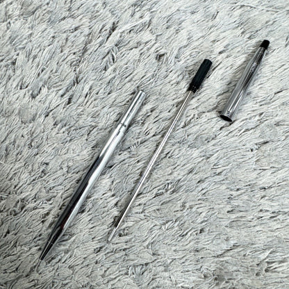 Cross Twist ballpoint pen with blue ink, Japan import, showing small scratches and twist-style design