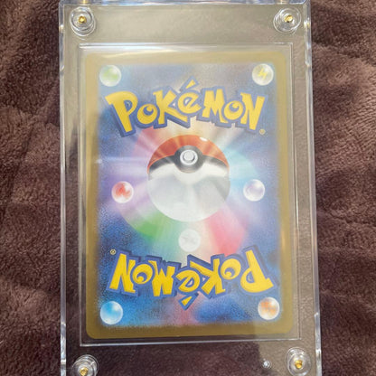 Mega Rayquaza Ex Mur Pokemon trading card from the Mega Brave expansion pack in sleeve and loader