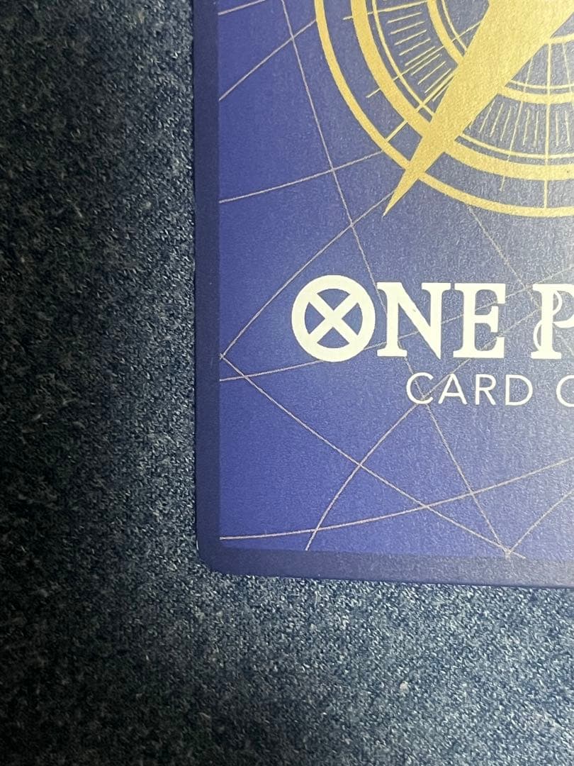 Bandai Nami Premium Card OP02-036 parallel film showing front with Bandai branding and parallel type details