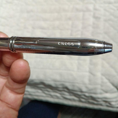 Cross metal ballpoint pen in silver with twist design shown on white background