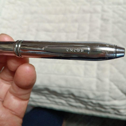 Cross metal ballpoint pen in silver with twist design shown on white background