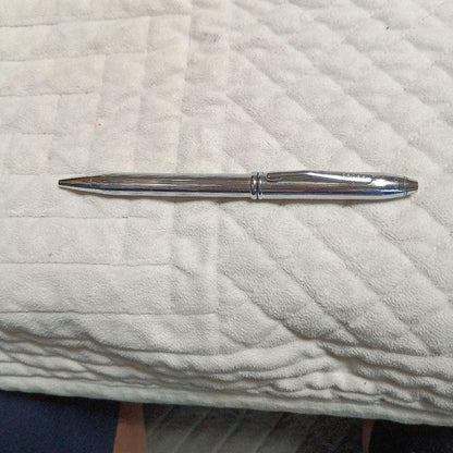 Cross metal ballpoint pen in silver with twist design shown on white background