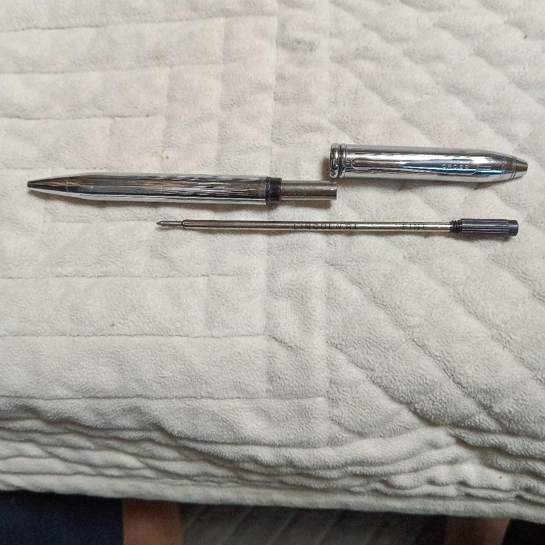 Cross metal ballpoint pen in silver with twist design shown on white background