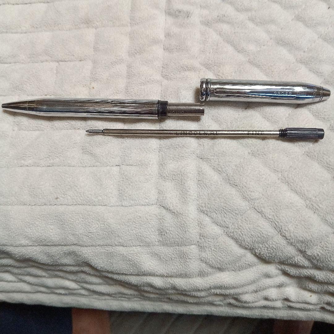 Cross metal ballpoint pen in silver with twist design shown on white background