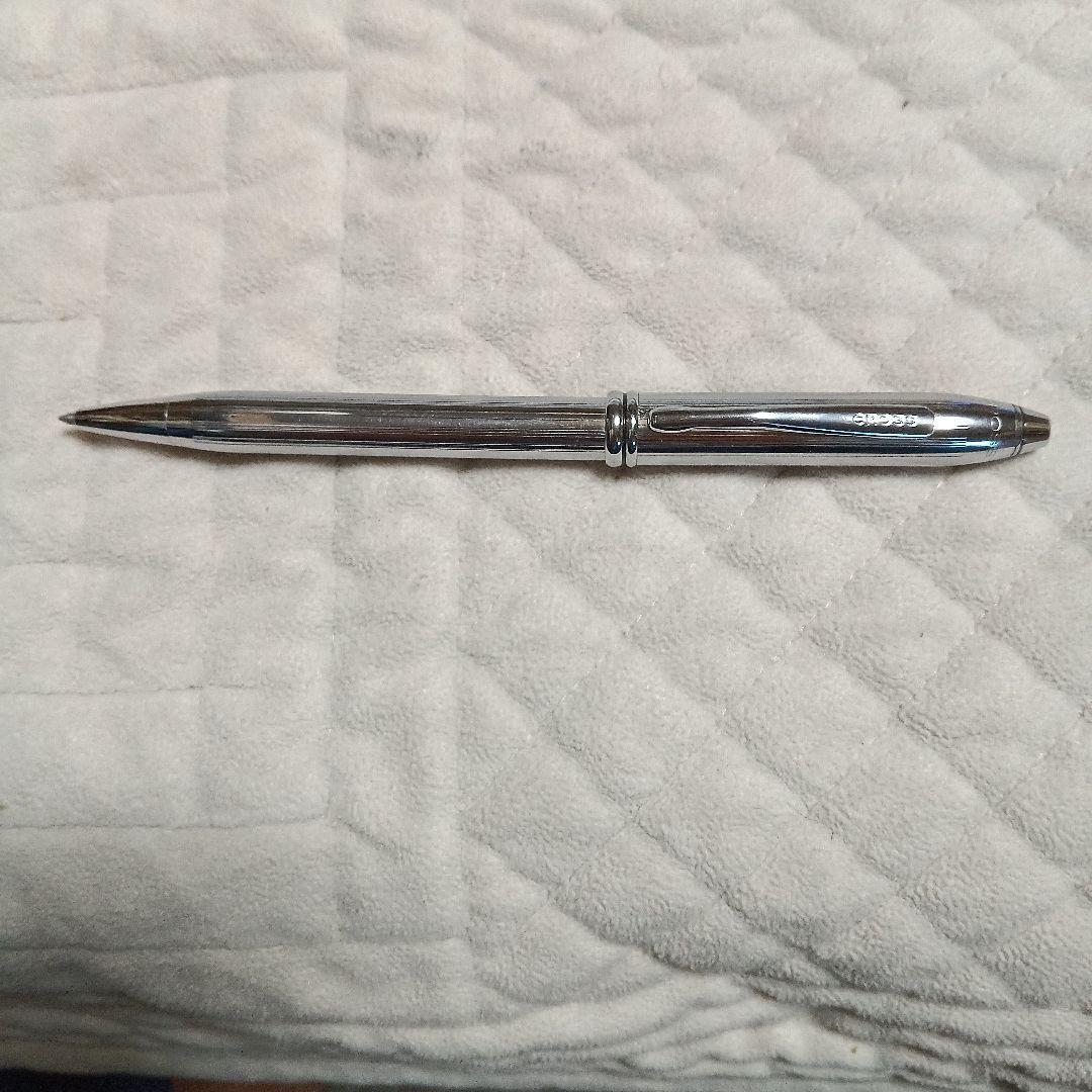 Cross metal ballpoint pen in silver with twist design shown on white background
