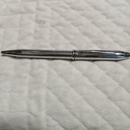 Cross metal ballpoint pen in silver with twist design shown on white background