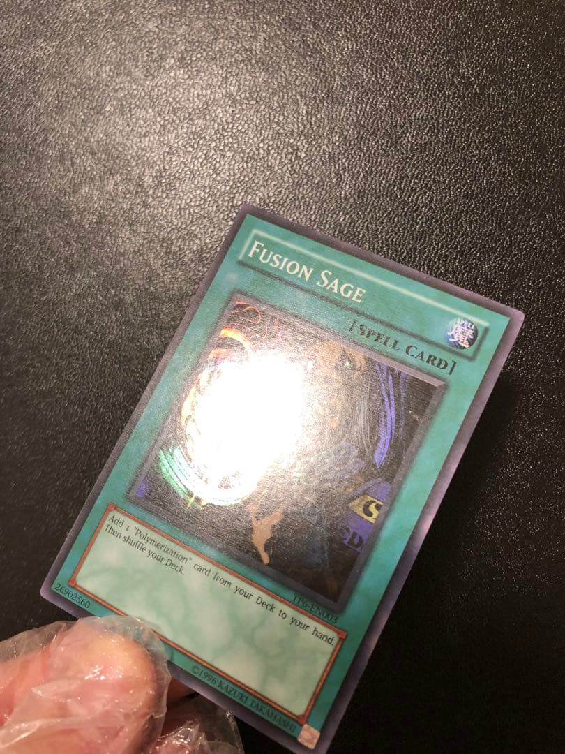 Yu-Gi-Oh Fusion Sage TP edition super rare trading card with visible scratches front view