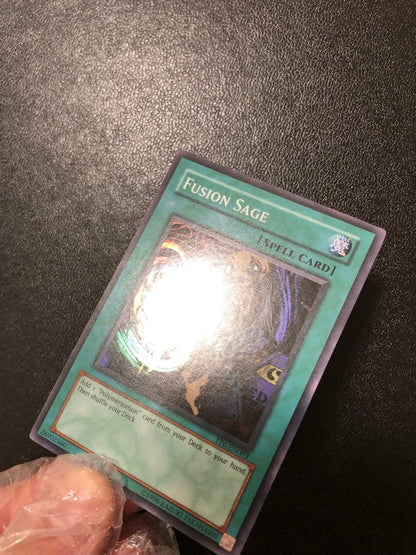 Yu-Gi-Oh Fusion Sage TP edition super rare trading card with visible scratches front view