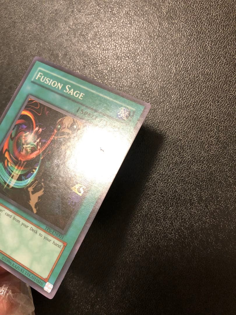 Yu-Gi-Oh Fusion Sage TP edition super rare trading card with visible scratches front view