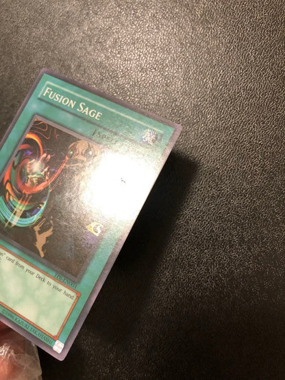 Yu-Gi-Oh Fusion Sage TP edition super rare trading card with visible scratches front view
