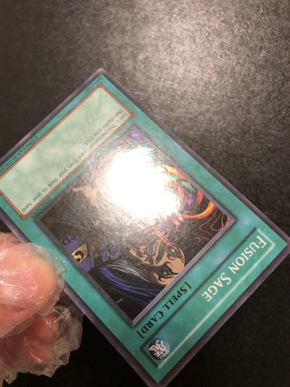 Yu-Gi-Oh Fusion Sage TP edition super rare trading card with visible scratches front view