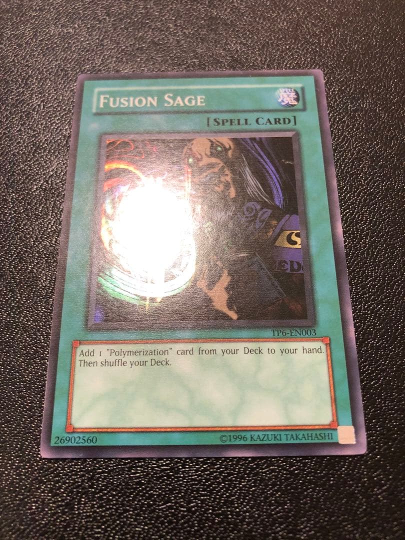Yu-Gi-Oh Fusion Sage TP edition super rare trading card with visible scratches front view