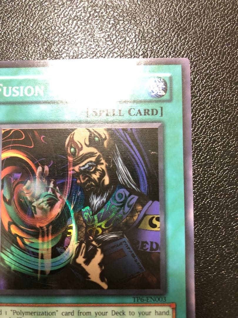 Yu-Gi-Oh Fusion Sage TP edition super rare trading card with visible scratches front view