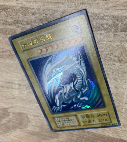 Vintage Yu-Gi-Oh Blue Eyes White Dragon Initial Ultra trading card with retro appearance
