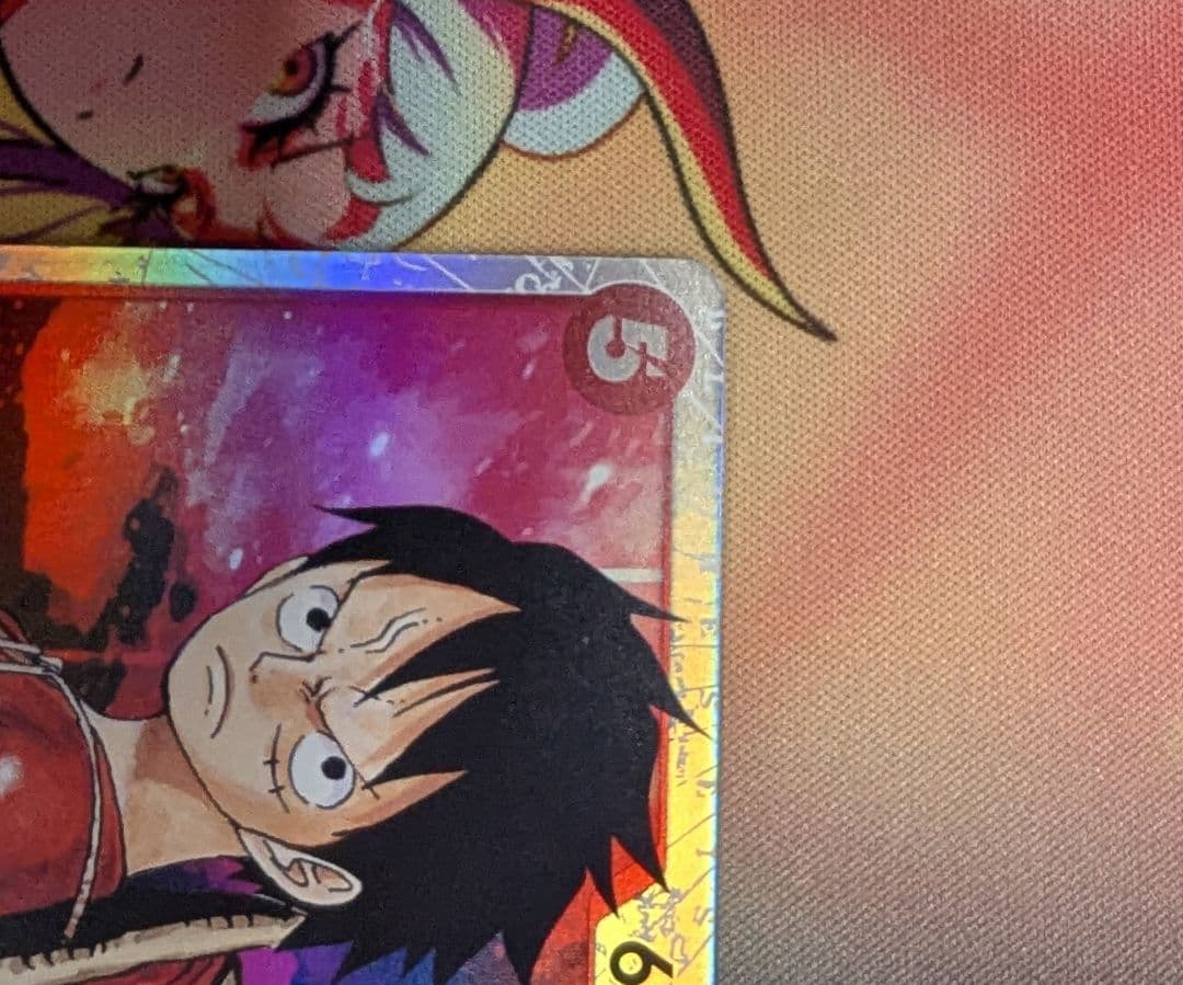 One Piece Monkey D. Luffy collectible card OP01-012 from the OP series in protective sleeve