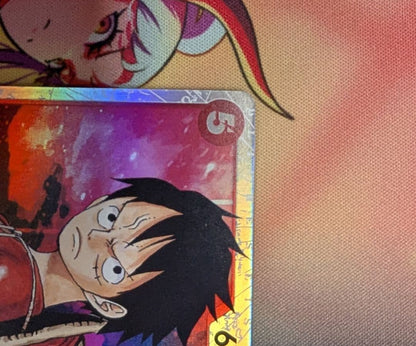 One Piece Monkey D. Luffy collectible card OP01-012 from the OP series in protective sleeve