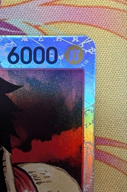 One Piece Monkey D. Luffy collectible card OP01-012 from the OP series in protective sleeve