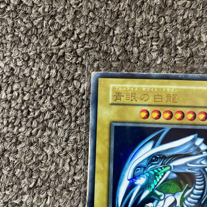 Yugioh Blue-Eyes White Dragon Initial Edition trading card from Japan in protective sleeve