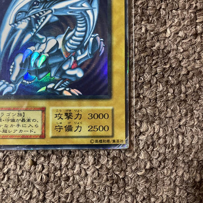 Yugioh Blue-Eyes White Dragon Initial Edition trading card from Japan in protective sleeve