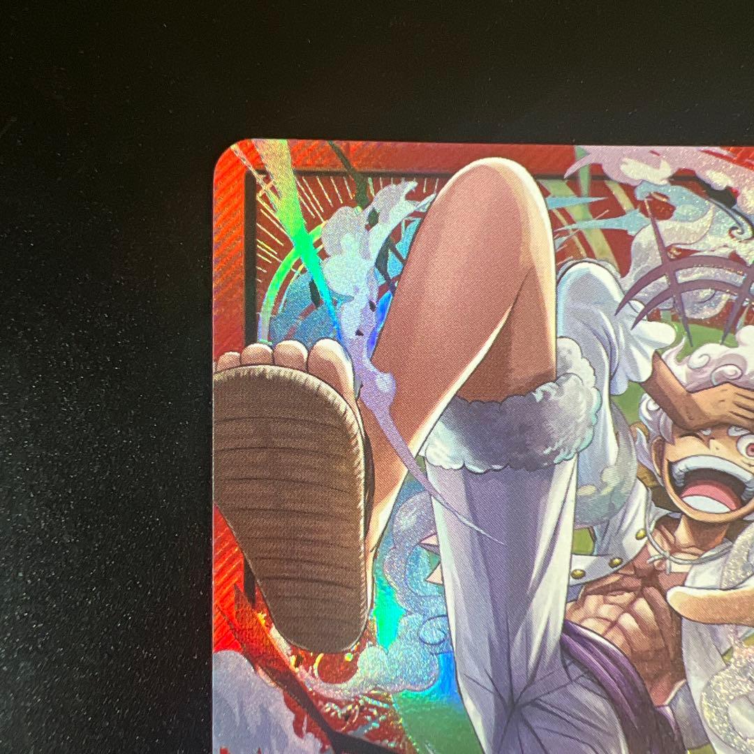 One Piece Monkey D. Luffy Leader trading card from Japan with visible edge scratches