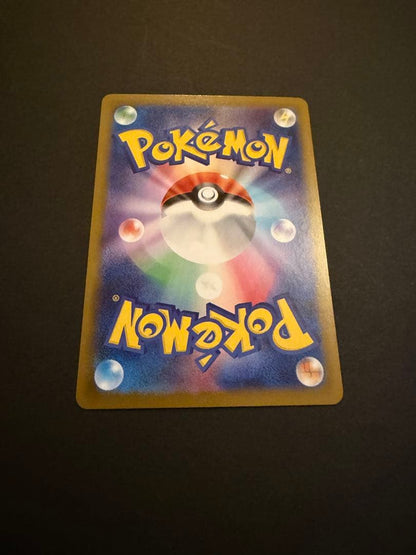Bandai Mega Charizard X X SAR 110/080 collectible card showing black Charizard, Charmander, and Charmeleon from Japan