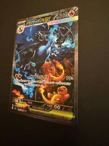 Bandai Mega Charizard X X SAR 110/080 collectible card showing black Charizard, Charmander, and Charmeleon from Japan