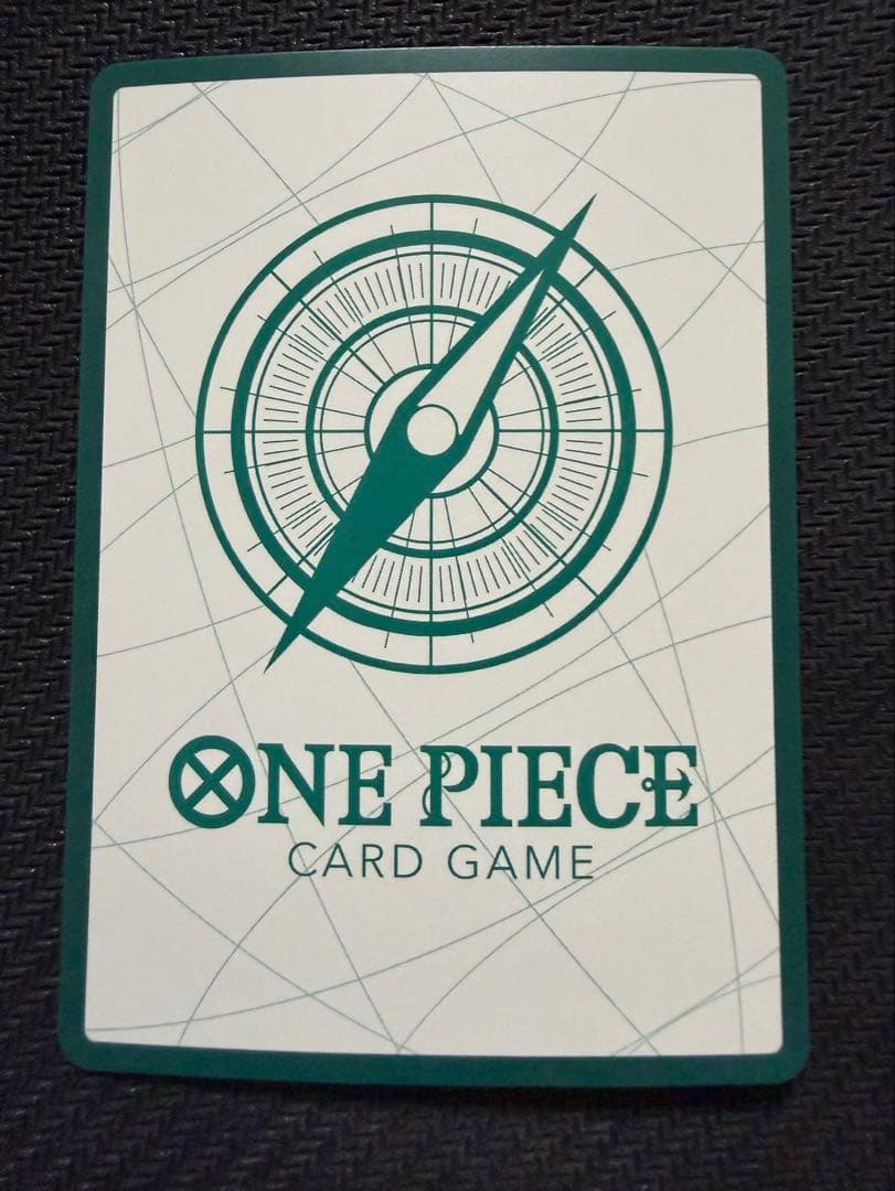 One Piece Fourth Emperor Don Card showing Shanks, Teach, Luffy with visible scratches and paint loss