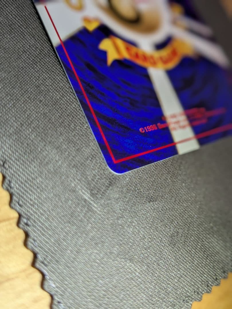Used Psyduck Pokemon trading card from old Japanese booster series with minor wear