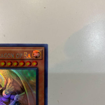 Bandai Yu-Gi-Oh Ra's Winged Dragon of Horus Ghost Rare card North America Edition in protective sleeve