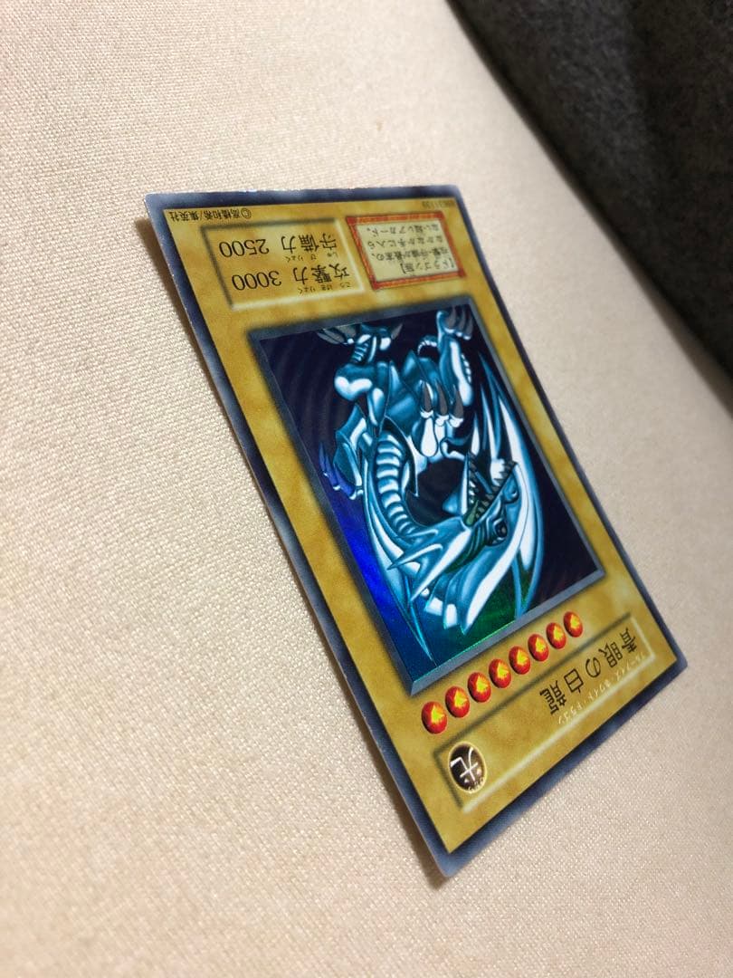 Bandai Yu-Gi-Oh Initial Blue-Eyes White Dragon Japanese card 006/165 SR with slight warping and minor scratches