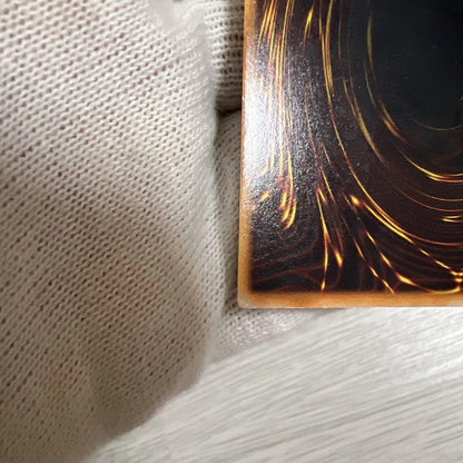 Yu-Gi-Oh! Early Series Holy Knight Dragon card with signs of wear in screw-down protective case