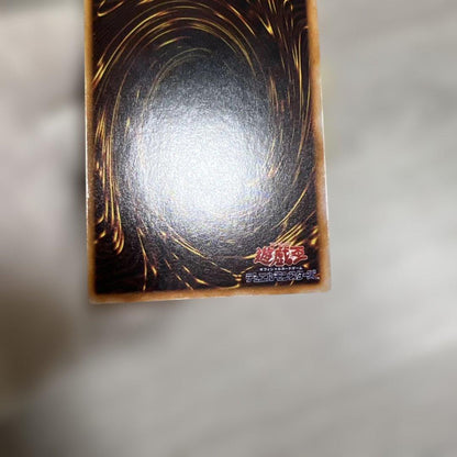 Yu-Gi-Oh! Early Series Holy Knight Dragon card with signs of wear in screw-down protective case