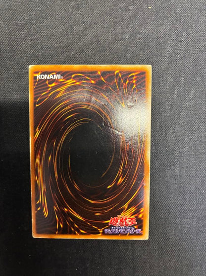 Blue-Eyes White Dragon Yu-Gi-Oh! trading card in early condition with visible signs of use