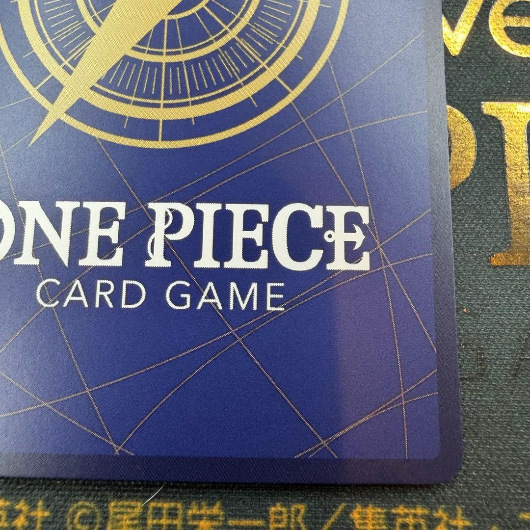 One Piece OP13-007 SR parallel figure card showing Ace, Sabo, and Luffy in PSA sleeve